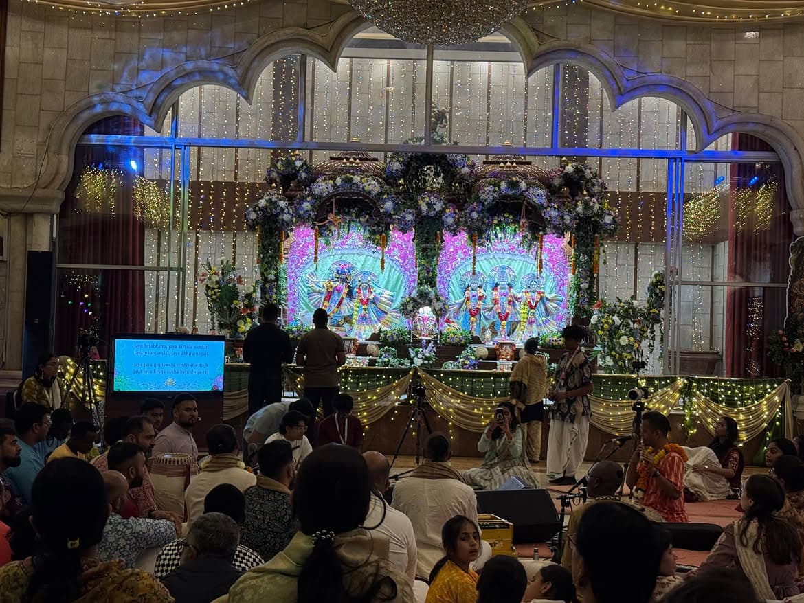 Devotees gathered in kirtan before the altar at ISKCON Nairobi